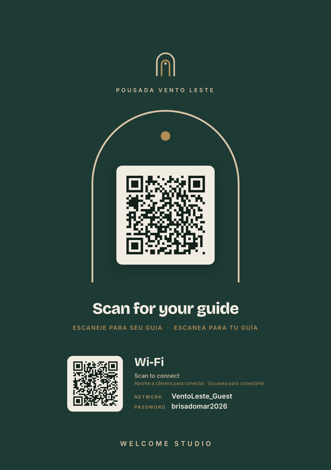 Welcome Studio display on a counter, with the guide QR and the Wi-Fi QR